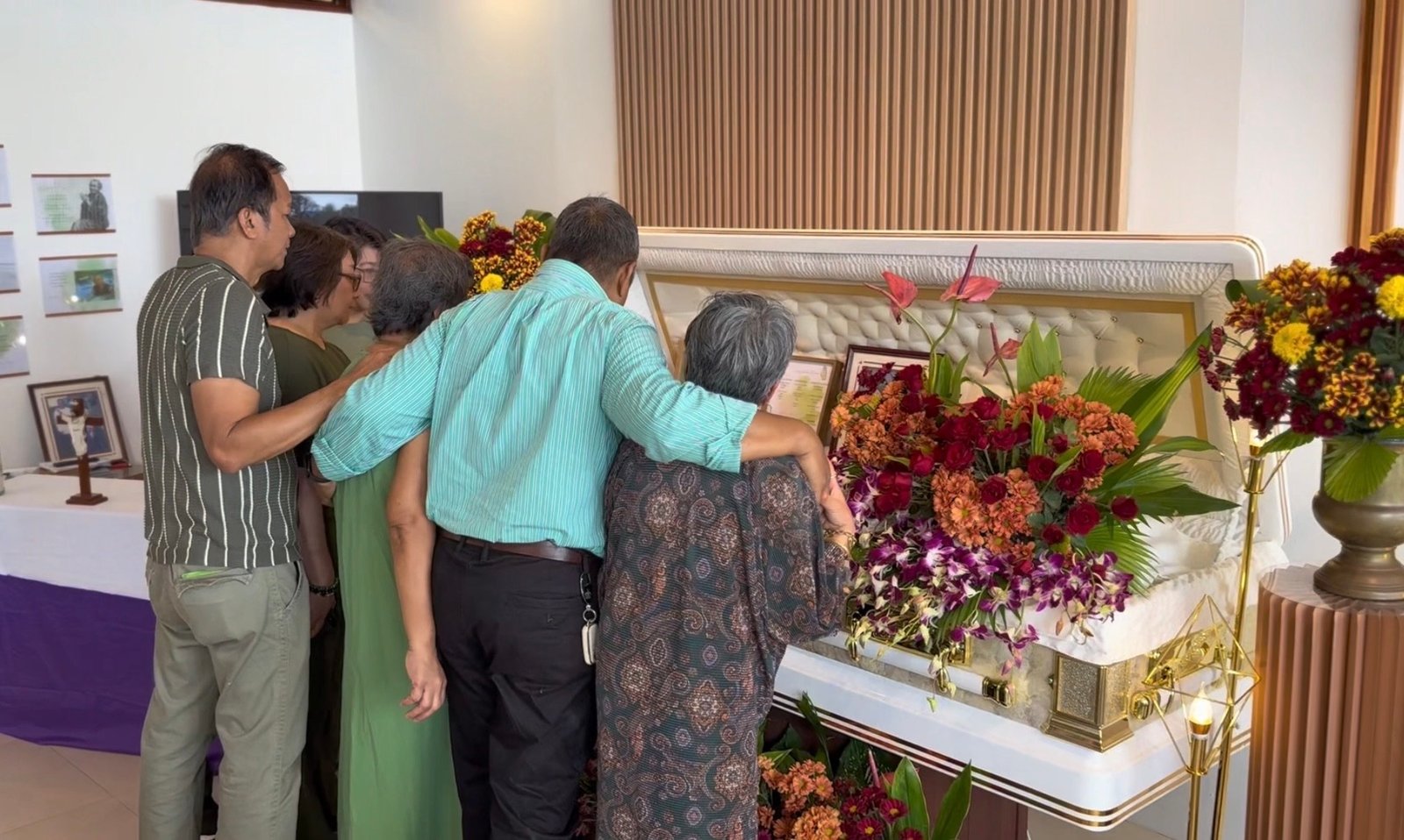 Family during a funeral service wake in a chapel in silang